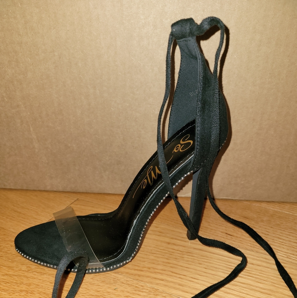 Black high heeled dress shoe